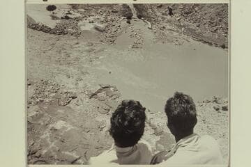 Maradel Marston and Mark Swain watch White-Pierce raft enter Badger Creek Rapid