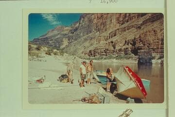 Repairing the "Wee Red" at the Vulcans Anvil.  Jon Hamilton bends over at left.  Ed l'Anson and Jim Bechtel watch Buzz Belknap at the polishing