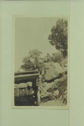 The Zahn party and their Franklin car at a lunch stop in Marsh Pass where they painted the sign on the rock.  The car was taken to the San Juan River at the Zahn Mine