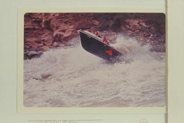 The "Triangle" topping the first wave in Vulcan Rapid with Jim Bechtel driving and Bob Valentine riding.  The course chosen is too far to the right and the control of the boat has been lost at the point of this picture