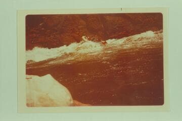 An inflated unit in the rough water of "The Little Riffle", Vulcan Rapid or Lava Falls