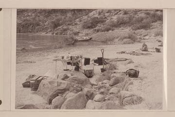 Camp gear and sleeping quarters at Mile 192; boat mooring.  Masland is breaking out of the sack