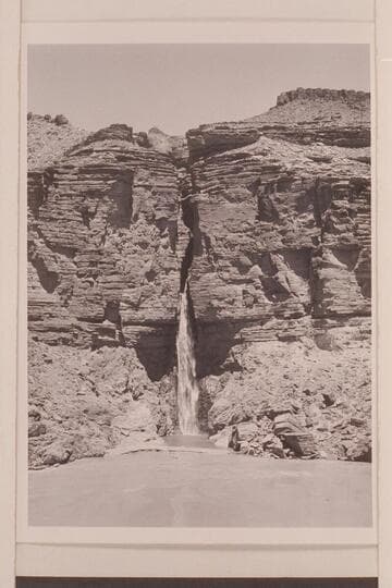 Deer Creek Falls.  The clear water of the lagoon is held by a low sand bar