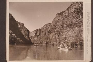 Near head of Canyon of Lodore.  Nevills oars the boat at left and Kent Frost is at right