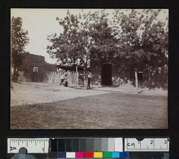 Two boys in a town or settlement