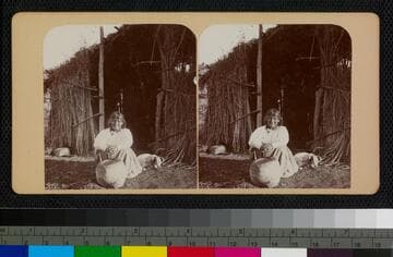 A Cahuilla woman using a stone mortar and pestle (or metate)