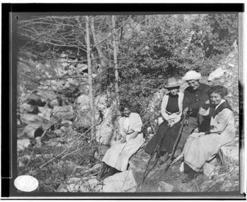 Three unknown women and a man in an unknown location