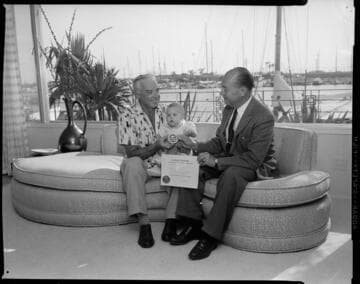 Man receiving Medallion Home certificate award at boat harbor