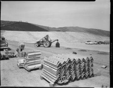 Construction site with angle steel on pallets