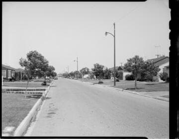 Street lights on a residential street in the day