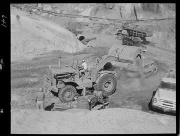 Big Creek - Mammoth Pool - DW-20 dumping fill in riverbed area upstream of cutoff