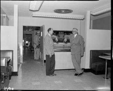 Men talking in a commercial kitchen
