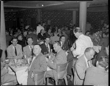 People at tables eating