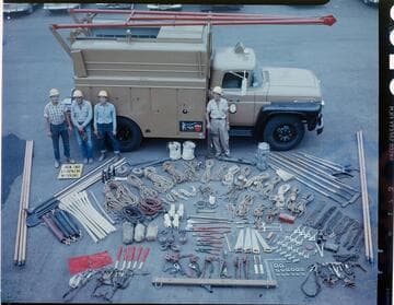 Line truck & crew with all tools, equipment, and materials laid-out