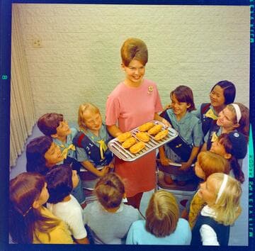 Home Economist Hillary Guild with group of Girl Scouts