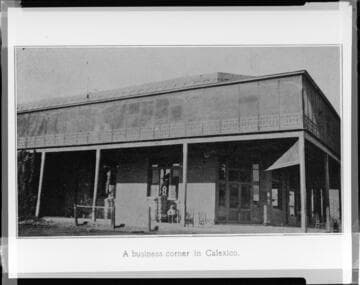 Building with hitching rail for horses in front