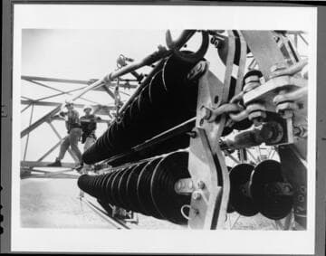 Linemen using "shepherds hook"