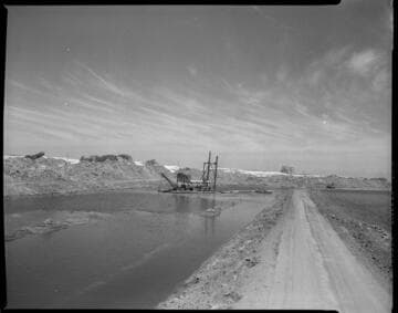 Dredging a canal for Alamitos Generating Station cooling water