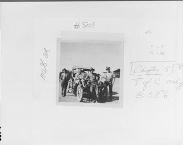 Three men leaning on the front of an automobile