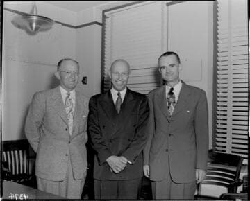 Three men in an office