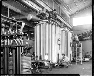 Men working on transformers