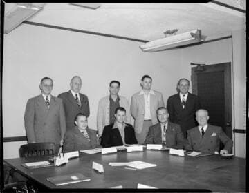 Posed photograph of  9 officers in Edison board room