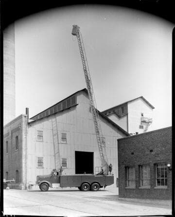 Edison bucket truck with bucket raised and extended to maximum height