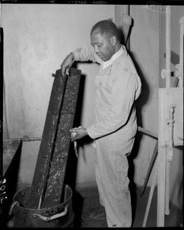 Janitor cleaning a piece of flashing