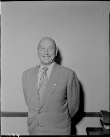 Man in suit with service pin