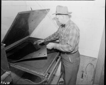 Man looking into open chest