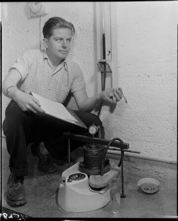 Man testing a device on  a scale