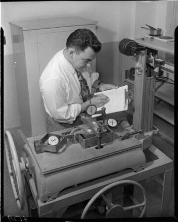 Man testing a device on  a scale
