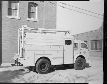 Edison customer service vehicle featuring compartments and hoists