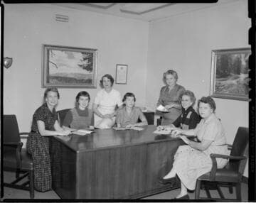 Group of women and model kitchens