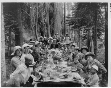 A large group of Big Creek families enjoying a rustic picnic