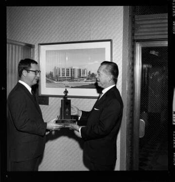 Building architects receiving trophys and awards