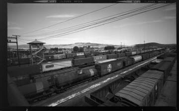 Train-yard with freight and passenger trains on sidings
