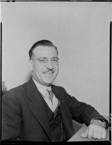 Mr. Zinn (smiling), local agent