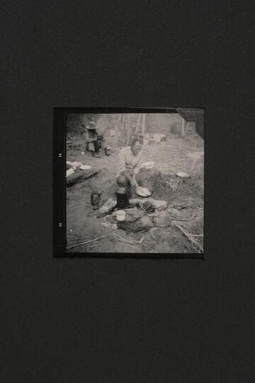 Tom Daly cooks, Buck Whitehat at back, Nasja Creek