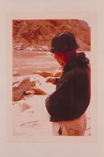 Dock Marston reads register left by Hatch party at the Kolb inscription