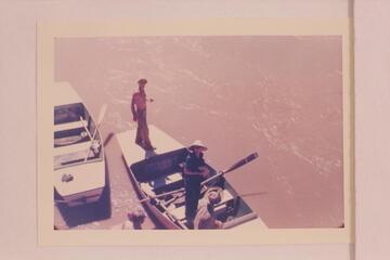 Norm Nevills in a characteristic pose on the deck of one of his San Juan punts