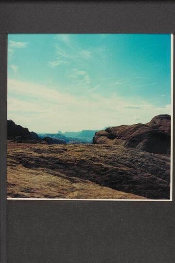 Southwest from summit between Side Canyon leading into Glen Canyon at Mile 83-84 and Wilson Creek draining into San Juan