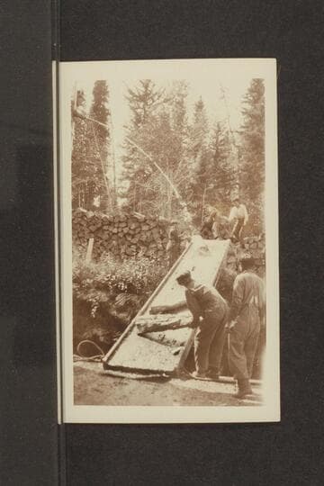 Hosing the chute to make the wood slide