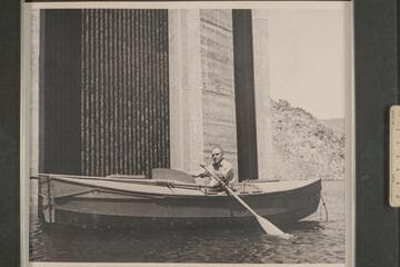 Buzz Holmstrom in his skiff, the "Julius F" after the end of the 1938 run from Wyoming to Lake Mead.  He was permitted to row down to the face of Hoover Dam for the publicity possibilities