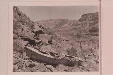 The "Ross Wheeler." built by Bert Loper for Charles Russell in 1914 and abandoned at Bass Cable in 1915.  She made the water traverse from Greenriver to Bass Cable with extended stops at Hite, Badger Creek Rapid, and below Pipe Creek
