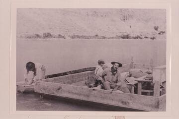 The "Canopy" without the canopy is moored at left of the scow.  Tommy Richardson and Arthur C. Waller are in the scow after return of the "Canopy" from cruise to Mile 105 which would be following Aug. 31