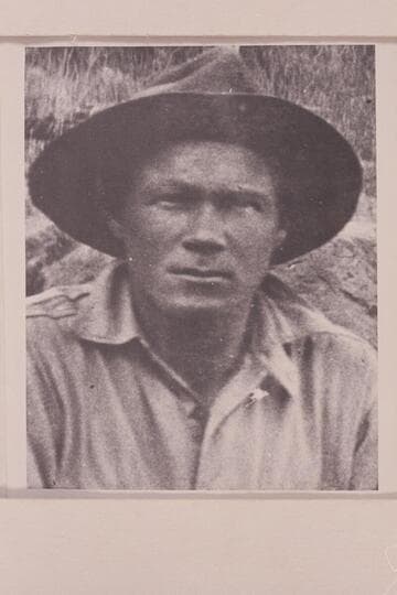 Harry Tasker at camp at Rapid #37, 21.7 miles below the mouth of Green River.  Cataract Canyon on the Colorado River.  Tasker worked with the USGS under direction of Chenoweth in the survey of Cataract Canyon and upper Glen Canyon in 1921