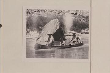 Bishop W. R. McConkie and Wayne McConkie in their canoe below the Junction in Cataract Canyon.  Doris Nevills is riding as passenger