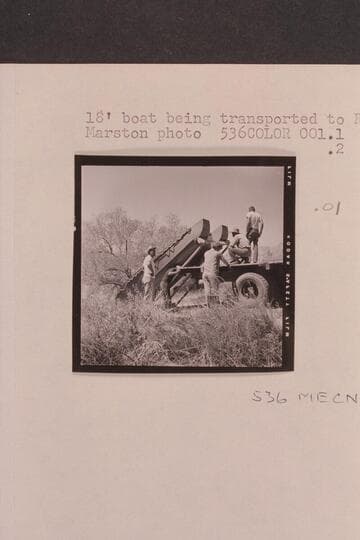 18 foot boat being transported to river by:  Claude, Rod, Dick, Vern and Jack