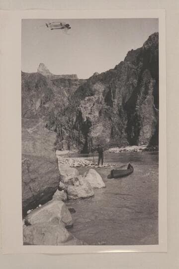 Holding one of Dave Rust's folding canvas boats at the shore near Bright Angel Creek